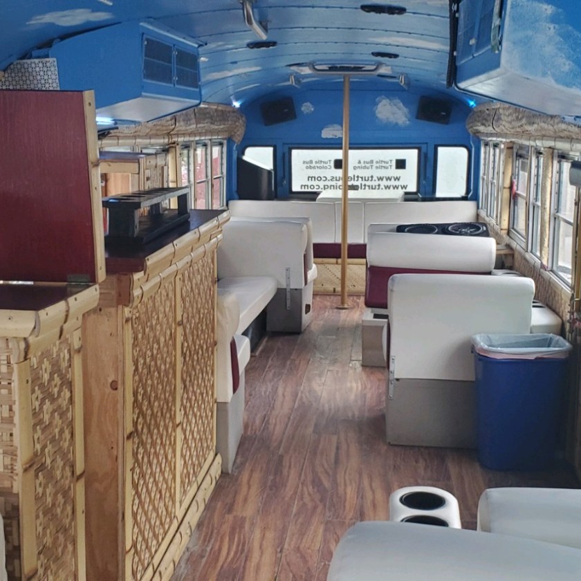 a bedroom with a bed and a chair in a room