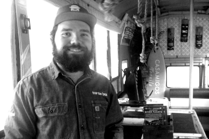 a man standing in front of a building