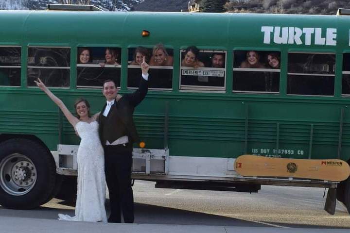 a person standing in front of a bus