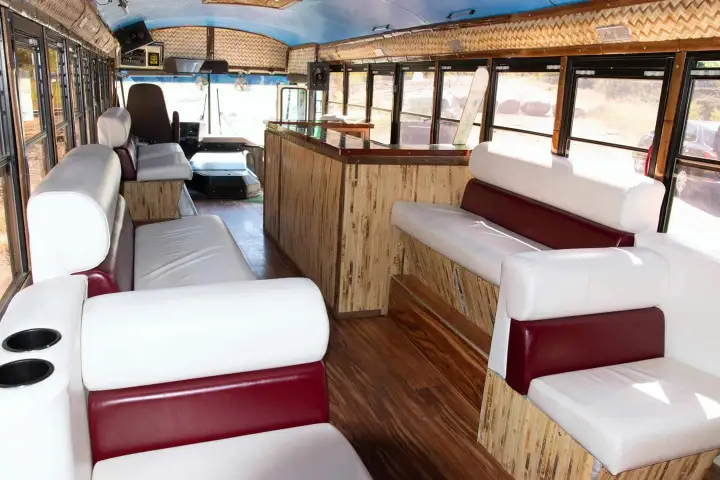 a living room filled with furniture and a large window